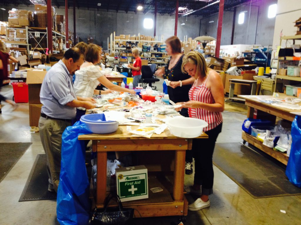 Sorting medical supplies at the Project CURE warehouse